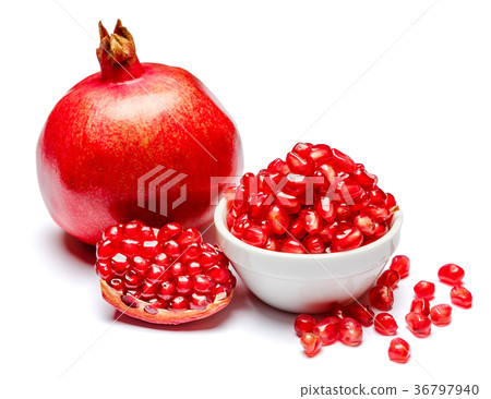 Pomegranate and seeds in ceramic bowl close-up 36797940