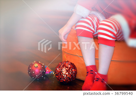 Little Santa's legs and Christmas toys Little Santa's legs and Christmas toys 36799540