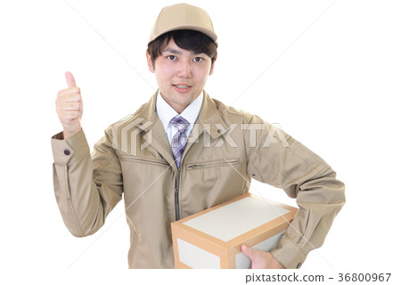 A man with a smile carrying baggage A man with a smile carrying baggage 36800967