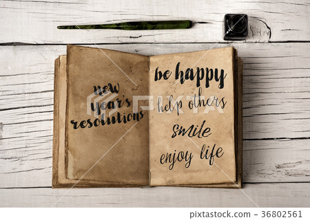 new years resolutions in a yellowish notebook new years resolutions in a yellowish notebook 36802561
