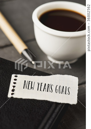 text new years goals in a piece of paper text new years goals in a piece of paper 36802562