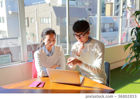 A couple planning an overseas trip A couple planning an overseas trip 36802853