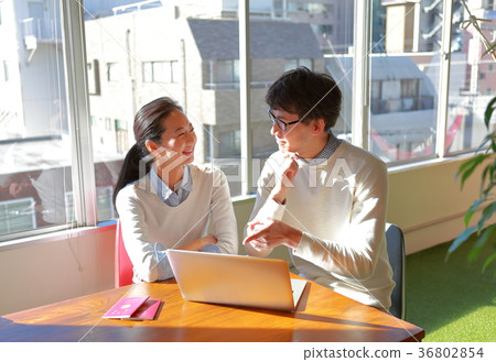 A couple planning an overseas trip A couple planning an overseas trip 36802854