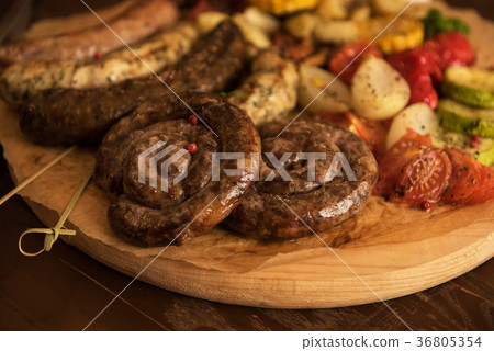 Grilled sausages with vegetables Grilled sausages with vegetables 36805354