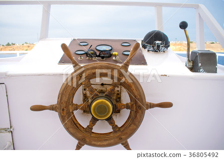 captain's bridge on the yacht. wooden helm of the captain's bridge on the yacht. wooden helm of the 36805492
