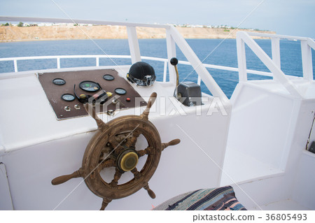 captain's bridge on the yacht. wooden helm captain's bridge on the yacht. wooden helm 36805493
