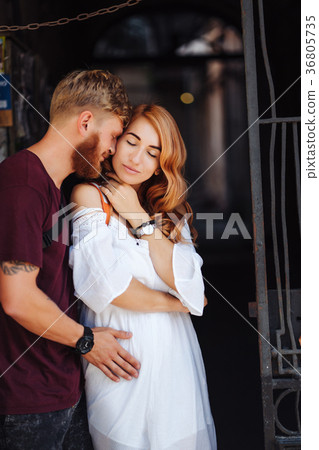 beautiful couple posing outdoors 36805735