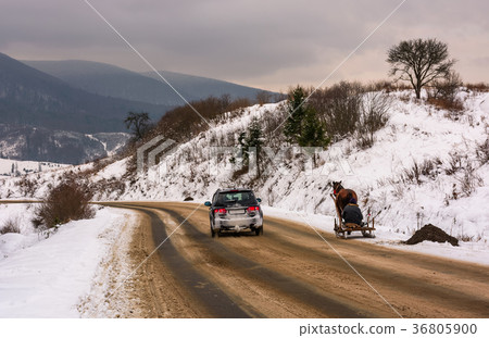 traffic in mountainous rural area in winter traffic in mountainous rural area in winter 36805900