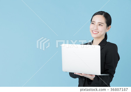 Female business woman blue back image Female business woman blue back image 36807187