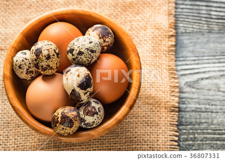 Fresh farm brown eggs on rustic background 36807331