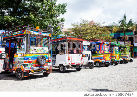 Motor-tricycles decorated as traditional Colombian Motor-tricycles decorated as traditional Colombian 36807484