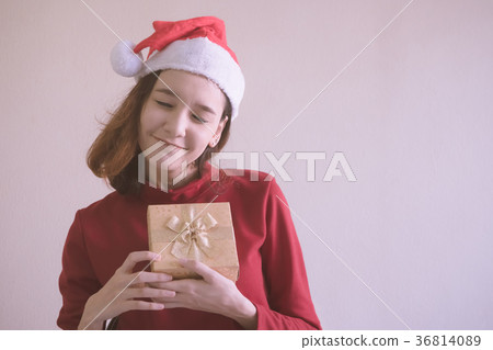 Happy Asian woman holding gift box. 36814089