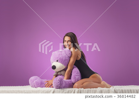 Woman with a huge teddy bear Woman with a huge teddy bear 36814482