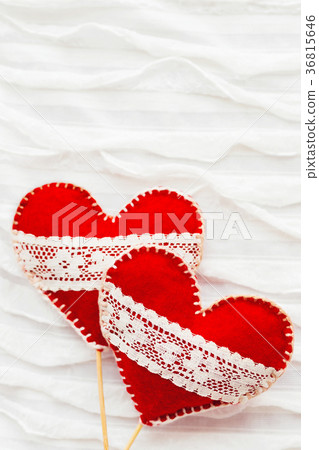 Two red felt hearts with laces, symbol of love Two red felt hearts with laces, symbol of love 36815646