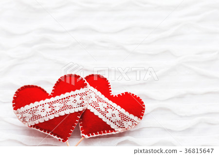 Two red felt hearts with laces, symbol of love Two red felt hearts with laces, symbol of love 36815647