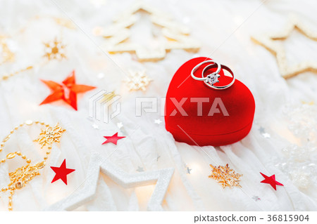 Red gift box with wedding rings and decorations Red gift box with wedding rings and decorations 36815904