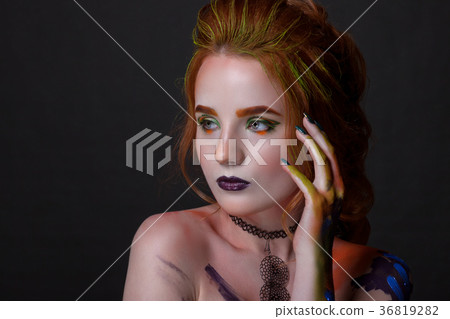 Portrait of a beautiful woman with a creative style Portrait of a beautiful woman with a creative style 36819282