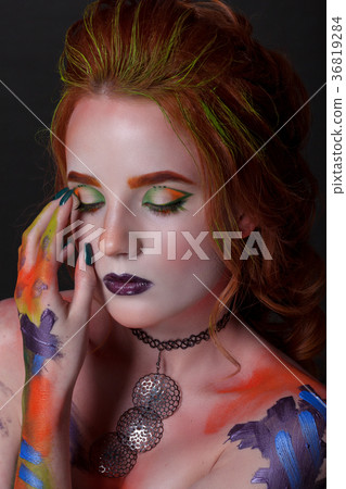 Portrait of a beautiful woman with a creative style Portrait of a beautiful woman with a creative style 36819284