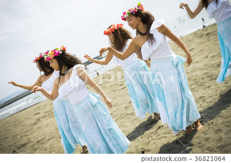 Hula dancer dancing on the beach 36821064