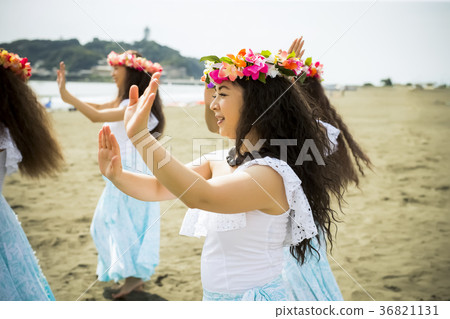 Hula dancer dancing on the beach 36821131