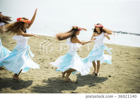 Hula dancer dancing on the beach 36821140