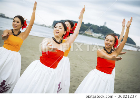 Hula dancer dancing on the beach 36821237