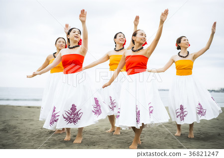 Hula dancer dancing on the beach 36821247