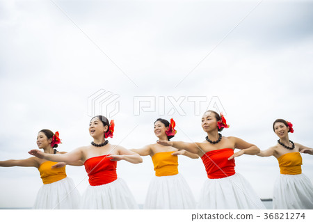 Hula dancer dancing on the beach 36821274