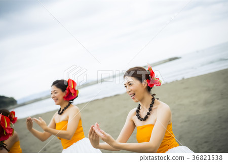 Hula dancer dancing on the beach 36821538