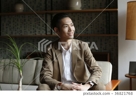 A businessman sitting on the sofa A businessman sitting on the sofa 36821768
