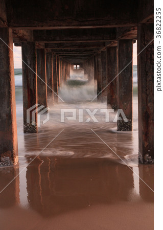 Waves sea and beach under the bridge 36822255