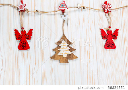 Christmas wooden toys are hung on a rope  36824551