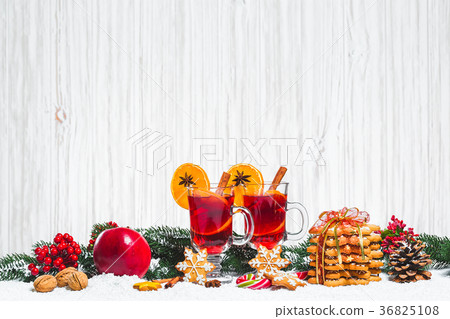 Christmas glass of red mulled wine on table 36825108