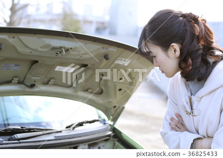 Woman who is troubled with car breakdown 36825433