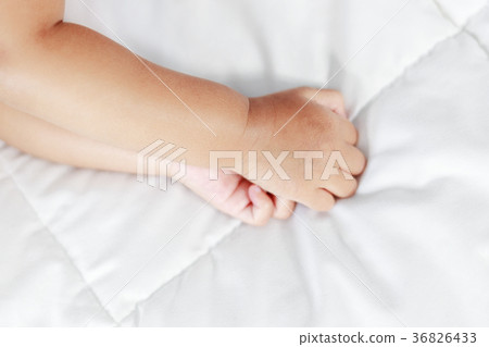 little baby hand on bed 36826433