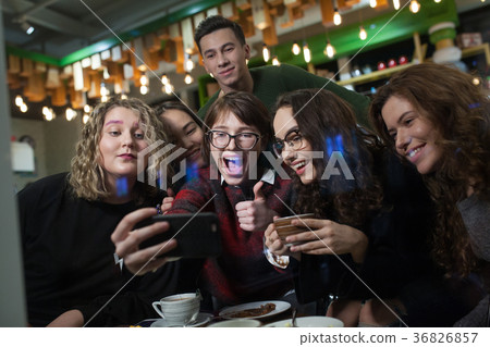 Group of positive teenagers make selfies and Group of positive teenagers make selfies and 36826857
