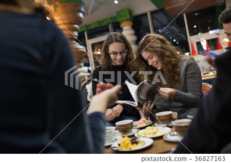 Group of teenagers doing homework in cafe. 36827163