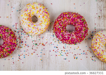 Multicolored donuts close-up 36827331