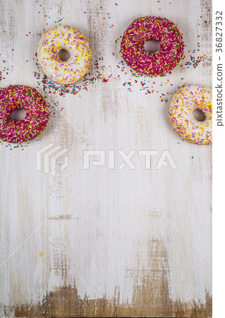 Multicolored donuts close-up 36827332