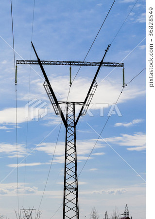 Steel electric pylon against the blue sky. Steel electric pylon against the blue sky. 36828549