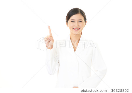 A smiling pharmacist who instructs A smiling pharmacist who instructs 36828802