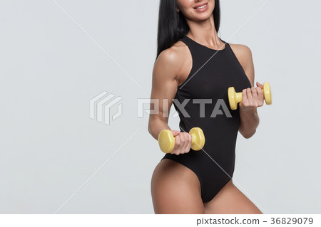 Girl with perfect sporty body on a white Girl with perfect sporty body on a white 36829079
