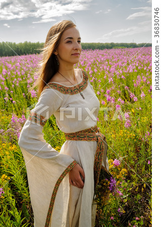 Beautiful girl relaxing among flowers 36830746