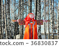 Maslenitsa Scarecrow in winter sunny day 36830837