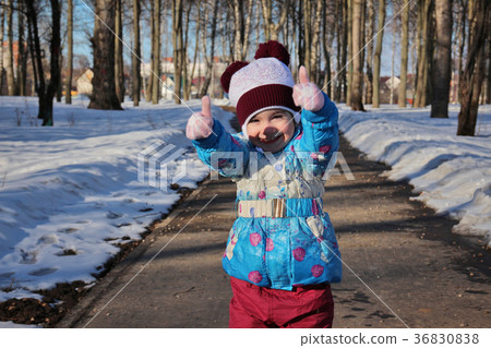 Little girl in winter sunny day 36830838