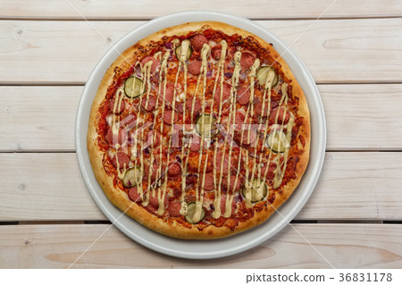 Top view of pizza with sausage and cucumber 36831178