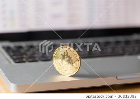 coin bitcoin on the laptop keyboard. the concept 36832382