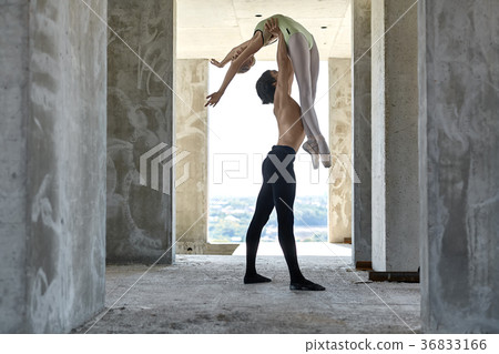 Ballet dancers posing at unfinished building Ballet dancers posing at unfinished building 36833166