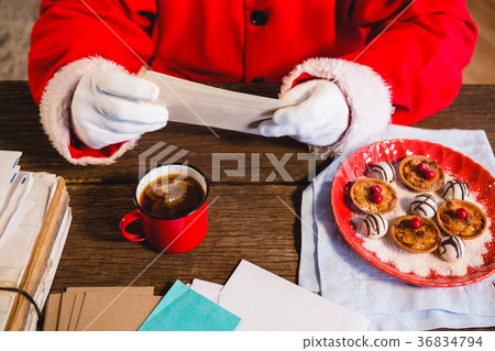 Santa Claus holding a letter 36834794