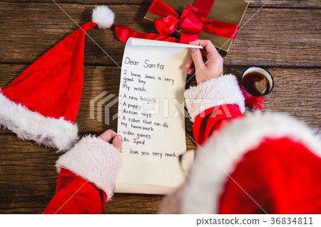 Santa Claus reading scroll Santa Claus reading scroll 36834811